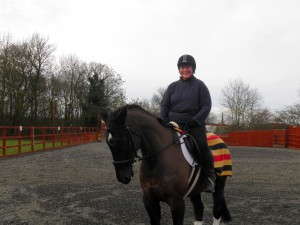 Benjji in the school with rider and owner, Lyn Byatt.